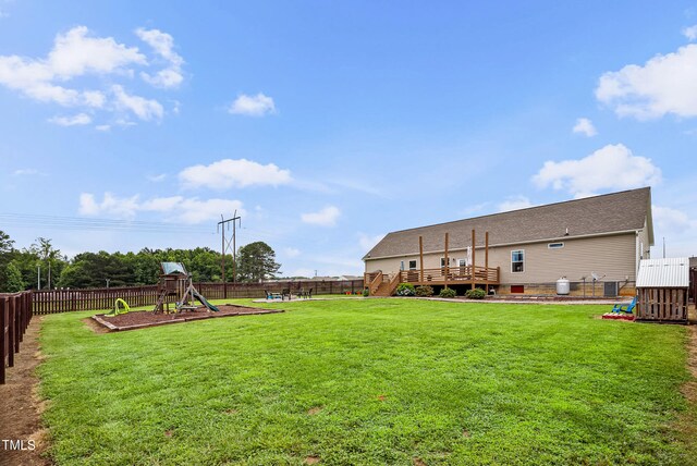 9300 Lake Wheeler Rd, Fuquay Varina, NC 27526 - view of yard featuring a playground, a wooden deck, and cooling unit