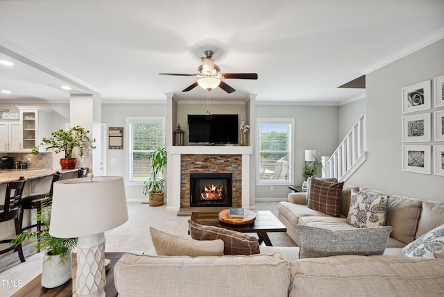 9300 Lake Wheeler Rd, Fuquay Varina, NC 27526 - carpeted living area featuring plenty of natural light, a ceiling fan, baseboards, ornamental molding, and recessed lighting