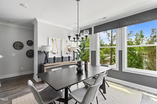 659 Bandon Aly, Cary, NC 27513 - dining area with a chandelier, healthy amount of natural light, baseboards, ornamental molding, and wood finished floors