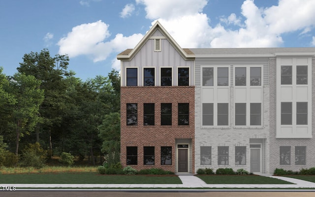 659 Bandon Aly, Cary, NC 27513 - view of front of property with a front lawn, board and batten siding, and brick siding