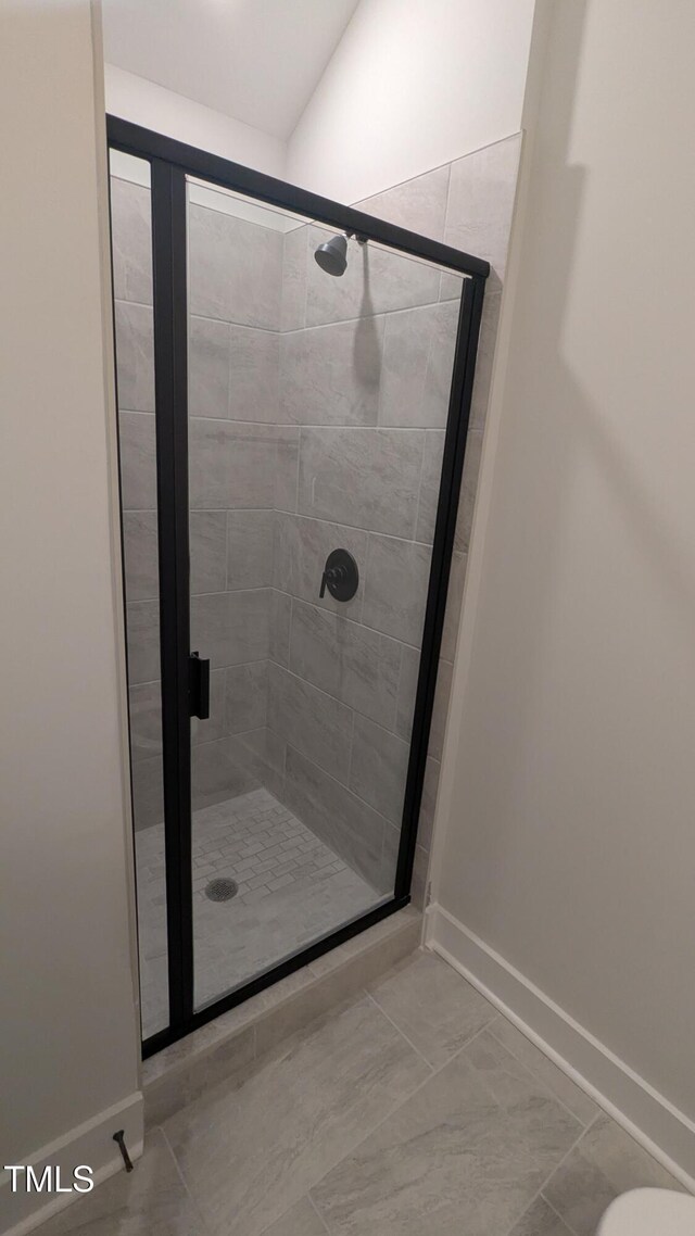 659 Bandon Aly, Cary, NC 27513 - bathroom with a stall shower, baseboards, and toilet