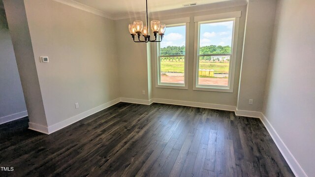 659 Bandon Aly, Cary, NC 27513 - unfurnished dining area featuring a chandelier, dark wood-type flooring, baseboards, and crown molding
