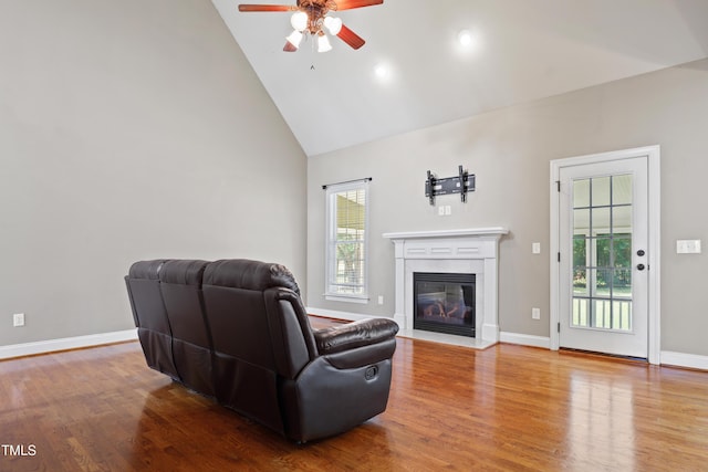 37 Meadow Oaks Cir, Smithfield, NC 27577 - living area featuring a ceiling fan, high vaulted ceiling, healthy amount of natural light, wood finished floors, and a fireplace with flush hearth