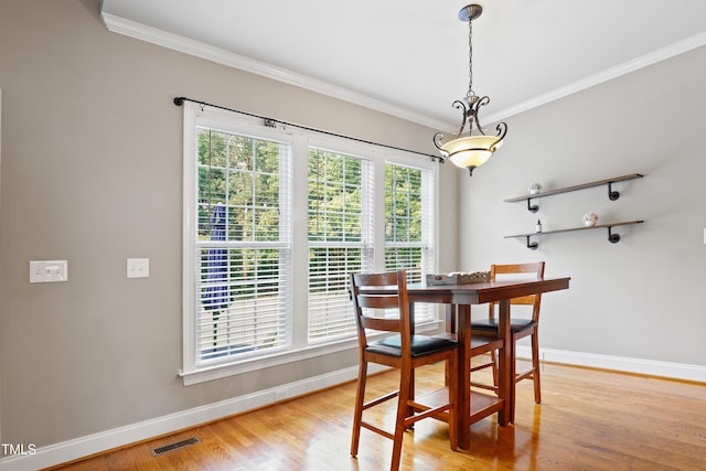 37 Meadow Oaks Cir, Smithfield, NC 27577 - dining area with baseboards, crown molding, and light wood-type flooring