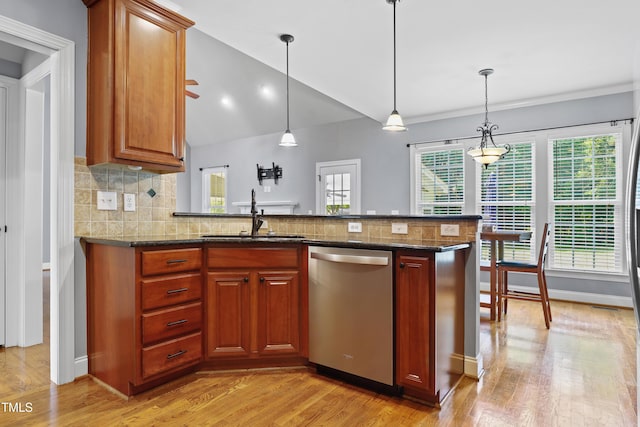 37 Meadow Oaks Cir, Smithfield, NC 27577 - kitchen featuring dishwasher, a sink, light wood-style flooring, tasteful backsplash, and pendant lighting