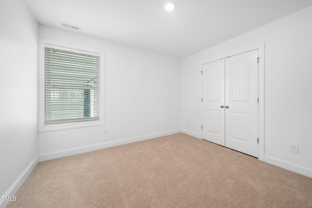 304 Azalea Gaze Dr, Youngsville, NC 27596 - unfurnished bedroom with carpet flooring, baseboards, and a closet