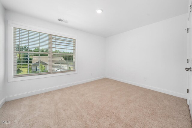 304 Azalea Gaze Dr, Youngsville, NC 27596 - empty room featuring light carpet, baseboards, and recessed lighting