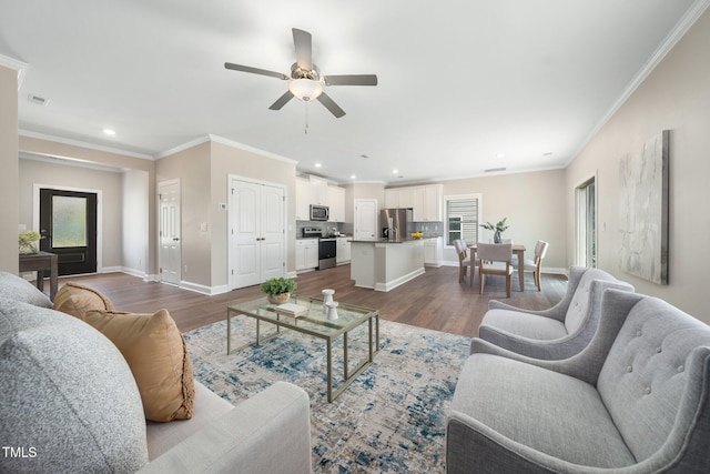 304 Azalea Gaze Dr, Youngsville, NC 27596 - living room featuring recessed lighting, dark wood finished floors, ceiling fan, ornamental molding, and baseboards