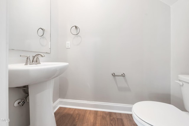 304 Azalea Gaze Dr, Youngsville, NC 27596 - half bathroom with toilet, baseboards, and wood finished floors