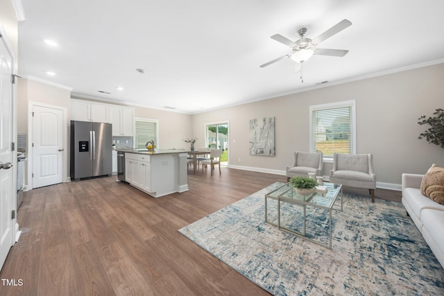304 Azalea Gaze Dr, Youngsville, NC 27596 - living room with ornamental molding, wood finished floors, a ceiling fan, recessed lighting, and baseboards