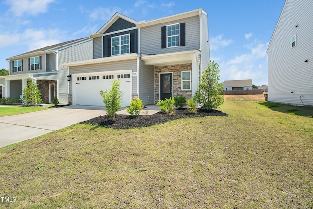 304 Azalea Gaze Dr, Youngsville, NC 27596 - view of front of home with stone siding, driveway, a front yard, and an attached garage