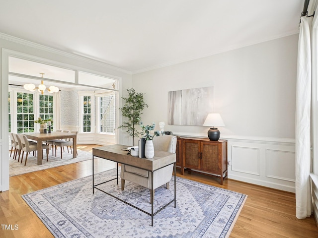 305 Promontory Point Dr, Cary, NC 27513 - office featuring a chandelier, crown molding, light wood-style flooring, and wainscoting