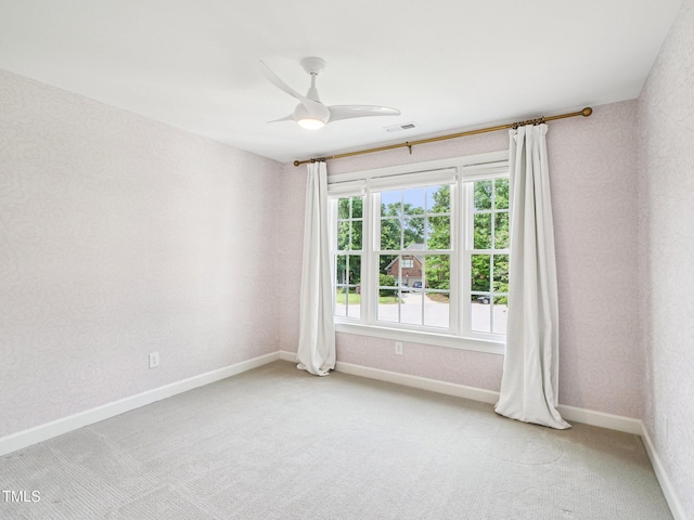 305 Promontory Point Dr, Cary, NC 27513 - spare room featuring light colored carpet, baseboards, and ceiling fan