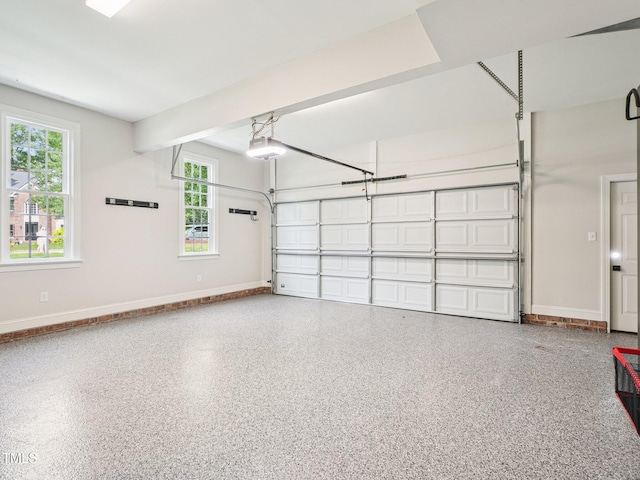 305 Promontory Point Dr, Cary, NC 27513 - garage featuring baseboards and a garage door opener
