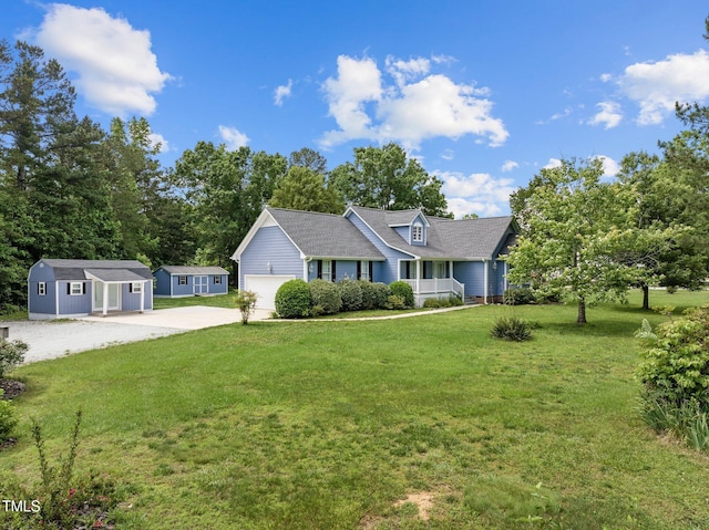 304 Foxcroft Dr, Timberlake, NC 27583 - ranch-style house featuring driveway, a front yard, an outbuilding, and covered porch