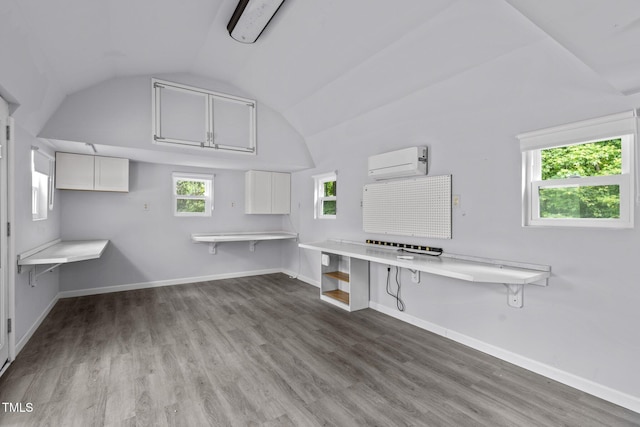 304 Foxcroft Dr, Timberlake, NC 27583 - unfurnished office with a wall mounted AC, lofted ceiling, and wood finished floors