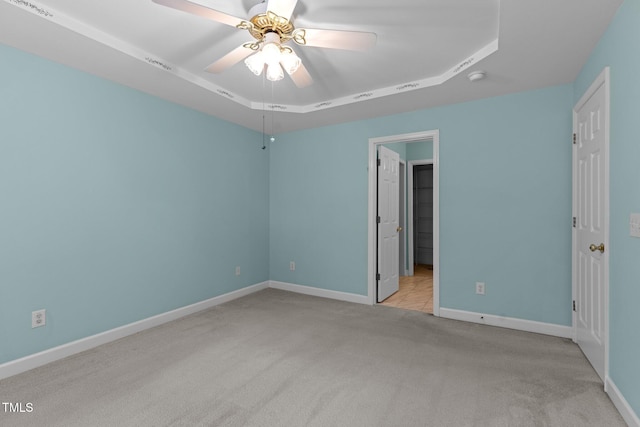 304 Foxcroft Dr, Timberlake, NC 27583 - unfurnished bedroom featuring carpet flooring, a raised ceiling, and a ceiling fan