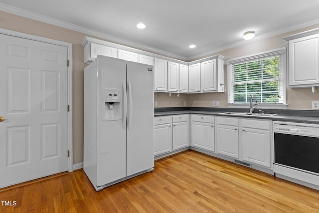 304 Foxcroft Dr, Timberlake, NC 27583 - kitchen featuring white refrigerator with ice dispenser, dishwasher, ornamental molding, dark countertops, and white cabinetry