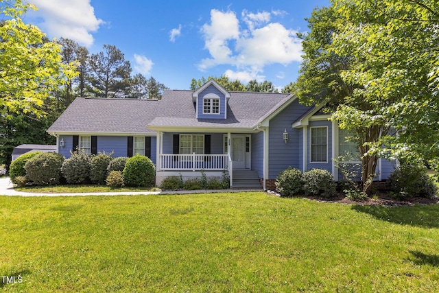 304 Foxcroft Dr, Timberlake, NC 27583 - cape cod house with a porch, a front yard, and a shingled roof