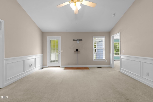 304 Foxcroft Dr, Timberlake, NC 27583 - empty room with lofted ceiling, light carpet, a decorative wall, a ceiling fan, and wainscoting
