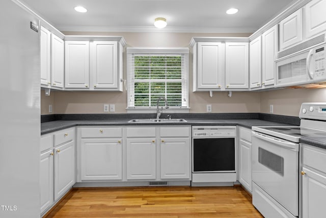 304 Foxcroft Dr, Timberlake, NC 27583 - kitchen featuring white appliances, white cabinetry, dark countertops, recessed lighting, and crown molding