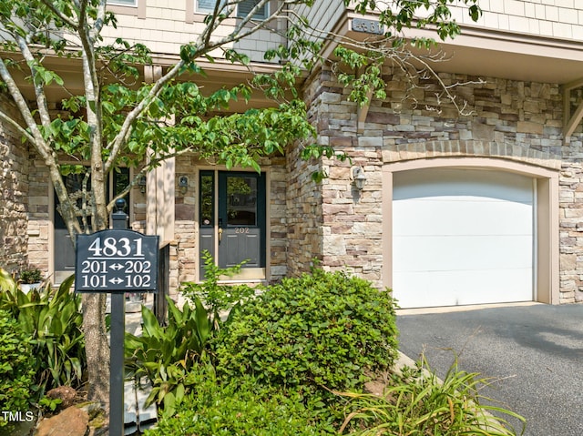 4831 Crestmore Rd Unit 202, Raleigh, NC 27612 - entrance to property featuring stone siding and asphalt driveway