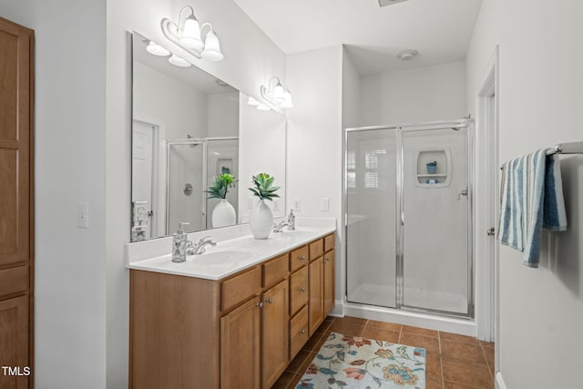 4831 Crestmore Rd Unit 202, Raleigh, NC 27612 - full bathroom featuring double vanity, a shower stall, and tile patterned flooring