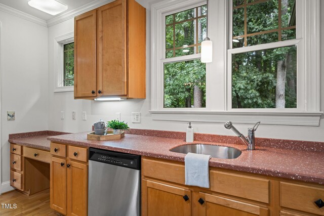 4831 Crestmore Rd Unit 202, Raleigh, NC 27612 - kitchen featuring stainless steel dishwasher, dark stone countertops, light wood-style floors, and ornamental molding