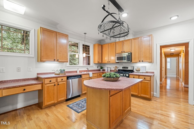 4831 Crestmore Rd Unit 202, Raleigh, NC 27612 - kitchen with stainless steel appliances, light wood-type flooring, ornamental molding, a kitchen island, and pendant lighting