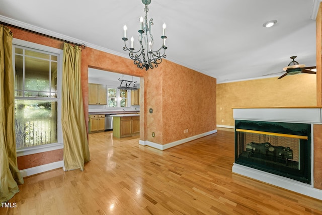 4831 Crestmore Rd Unit 202, Raleigh, NC 27612 - unfurnished dining area with a chandelier, a multi sided fireplace, ornamental molding, light wood-style flooring, and a ceiling fan