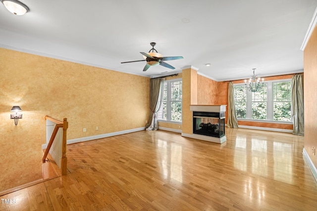 4831 Crestmore Rd Unit 202, Raleigh, NC 27612 - unfurnished living room with light wood finished floors, crown molding, a multi sided fireplace, a chandelier, and ceiling fan
