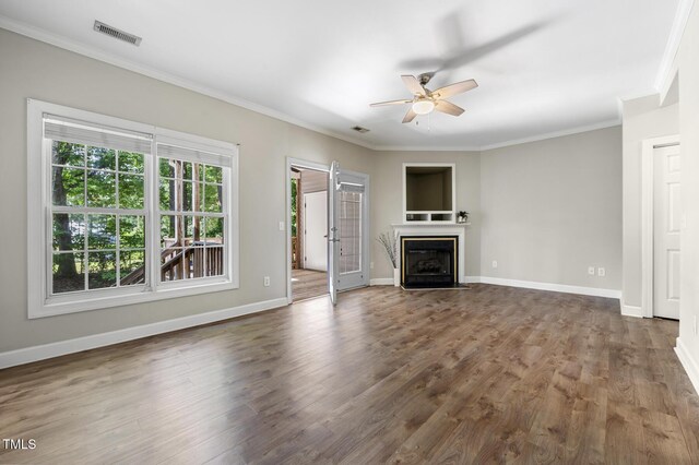 2623 Broad Oaks Pl, Raleigh, NC 27603 - unfurnished living room with a ceiling fan, crown molding, dark wood finished floors, a fireplace with flush hearth, and baseboards
