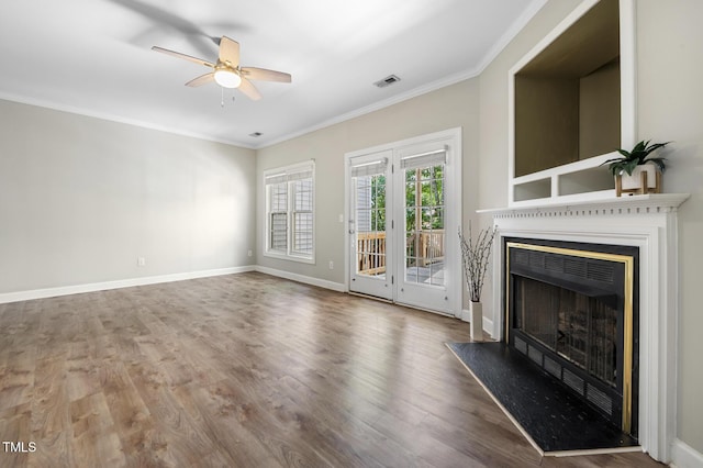2623 Broad Oaks Pl, Raleigh, NC 27603 - unfurnished living room with ceiling fan, a fireplace, crown molding, wood finished floors, and baseboards