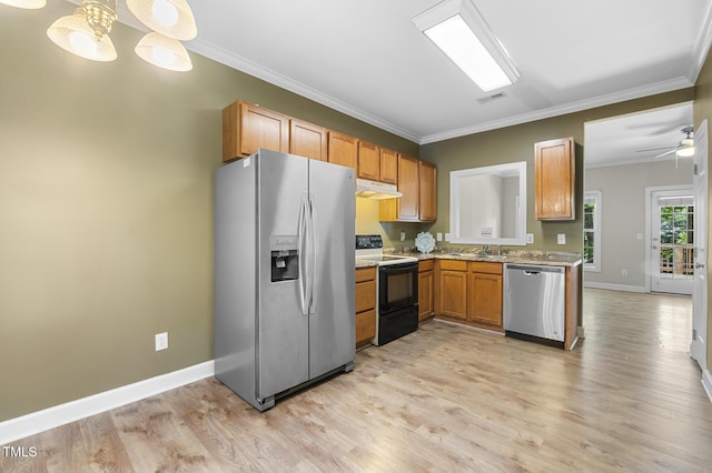 2623 Broad Oaks Pl, Raleigh, NC 27603 - kitchen with stainless steel appliances, under cabinet range hood, crown molding, baseboards, and light wood-style flooring