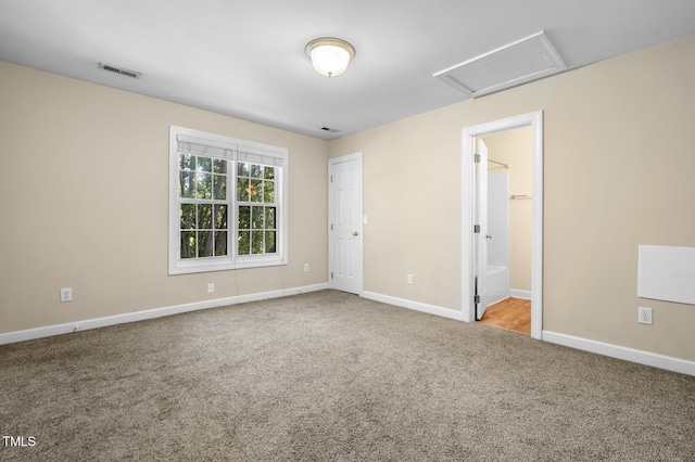 2623 Broad Oaks Pl, Raleigh, NC 27603 - unfurnished bedroom with carpet, attic access, baseboards, and connected bathroom