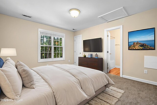 2623 Broad Oaks Pl, Raleigh, NC 27603 - carpeted bedroom with attic access, baseboards, and ensuite bath
