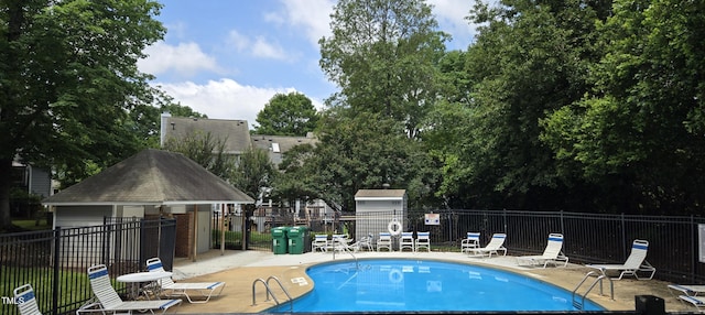 2623 Broad Oaks Pl, Raleigh, NC 27603 - community pool with a patio area and an outbuilding