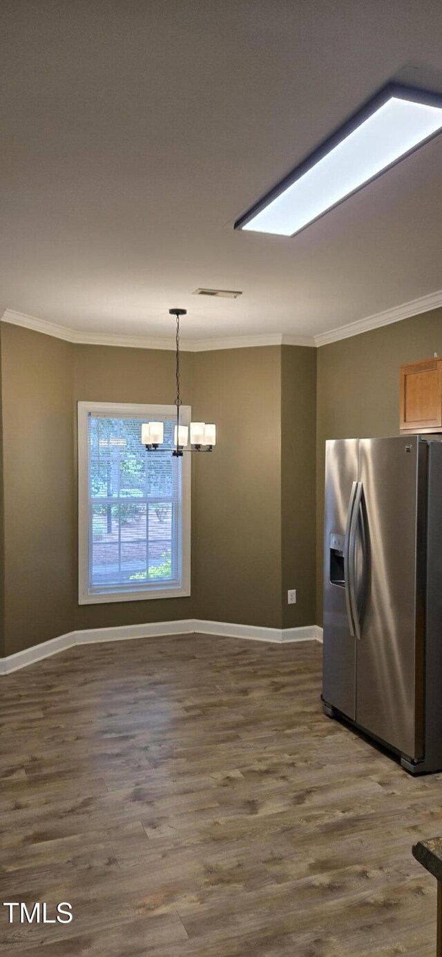 2623 Broad Oaks Pl, Raleigh, NC 27603 - kitchen featuring stainless steel fridge with ice dispenser, ornamental molding, a chandelier, dark wood-style flooring, and baseboards