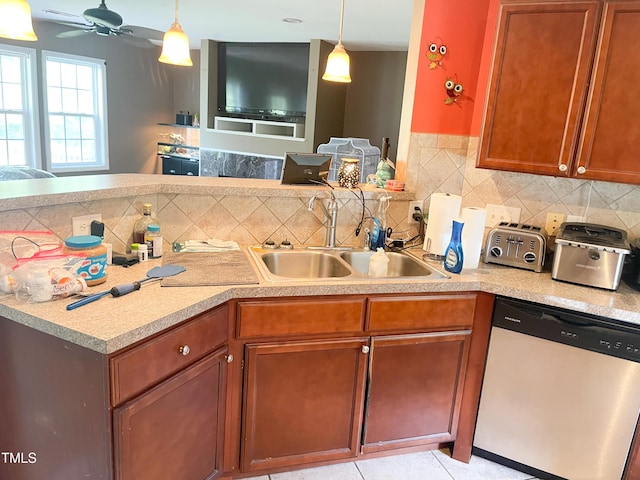 101 Langston Ridge Dr, Angier, NC 27501 - kitchen with stainless steel dishwasher, a sink, light countertops, a ceiling fan, and decorative backsplash