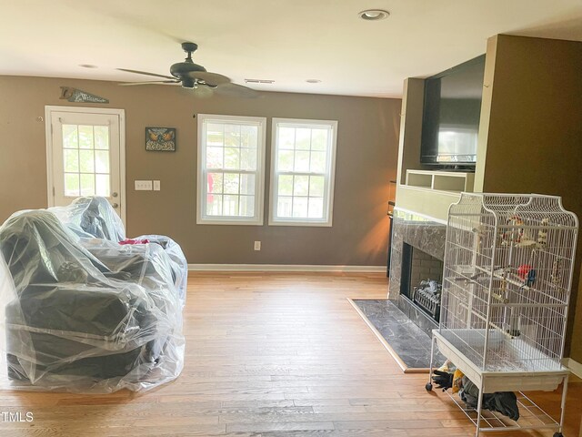 101 Langston Ridge Dr, Angier, NC 27501 - living area with ceiling fan, wood-type flooring, a fireplace, baseboards, and recessed lighting