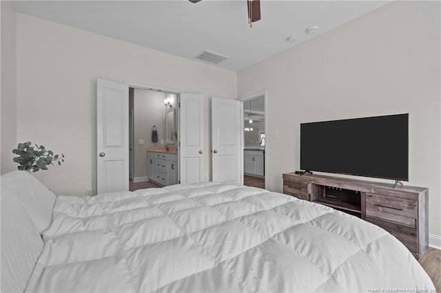 117 Titleist Ct, Raeford, NC 28376 - bedroom featuring connected bathroom, wood finished floors, baseboards, and ceiling fan