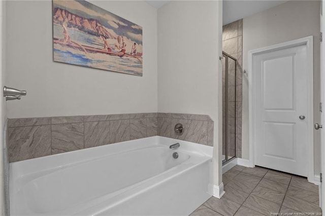 117 Titleist Ct, Raeford, NC 28376 - full bathroom with a garden tub, a stall shower, and baseboards