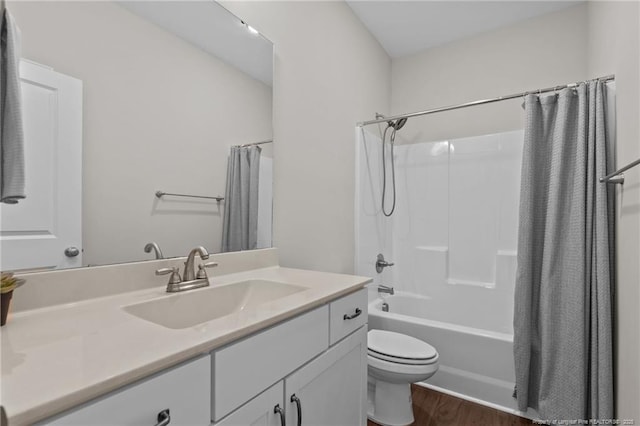 117 Titleist Ct, Raeford, NC 28376 - bathroom with vanity, toilet, wood finished floors, and shower / bath combination with curtain