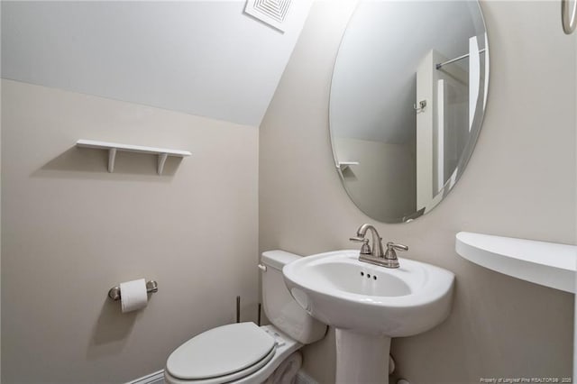 117 Titleist Ct, Raeford, NC 28376 - bathroom featuring toilet and lofted ceiling