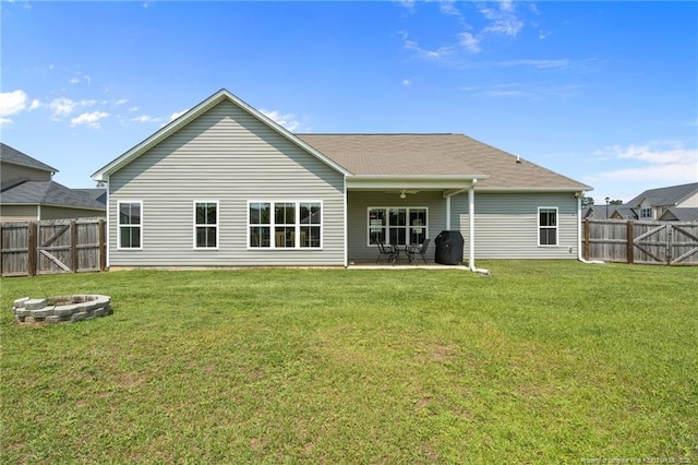 117 Titleist Ct, Raeford, NC 28376 - back of property with a fire pit and a patio area