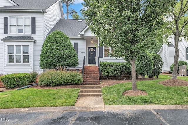 500 Center Pointe Dr, Cary, NC 27513 - view of front facade featuring roof with shingles and a front lawn