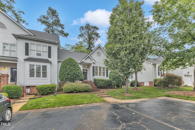 500 Center Pointe Dr, Cary, NC 27513 - view of front facade featuring uncovered parking, a shingled roof, and a front yard