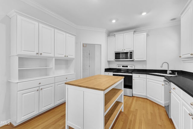 500 Center Pointe Dr, Cary, NC 27513 - kitchen with open shelves, appliances with stainless steel finishes, butcher block counters, a sink, and crown molding