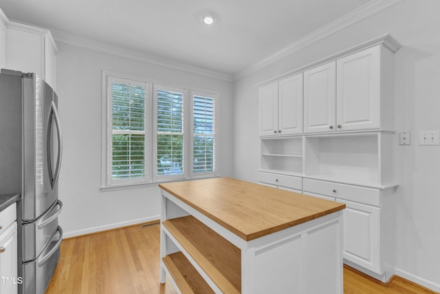 500 Center Pointe Dr, Cary, NC 27513 - kitchen with freestanding refrigerator, open shelves, white cabinets, light wood finished floors, and baseboards