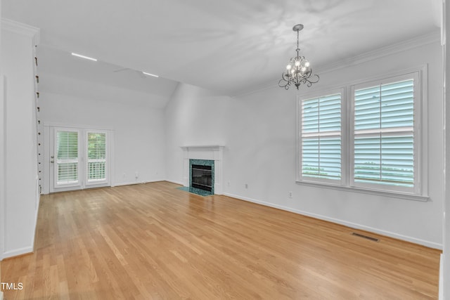 500 Center Pointe Dr, Cary, NC 27513 - unfurnished living room with a chandelier, light wood-style flooring, a fireplace, ornamental molding, and baseboards